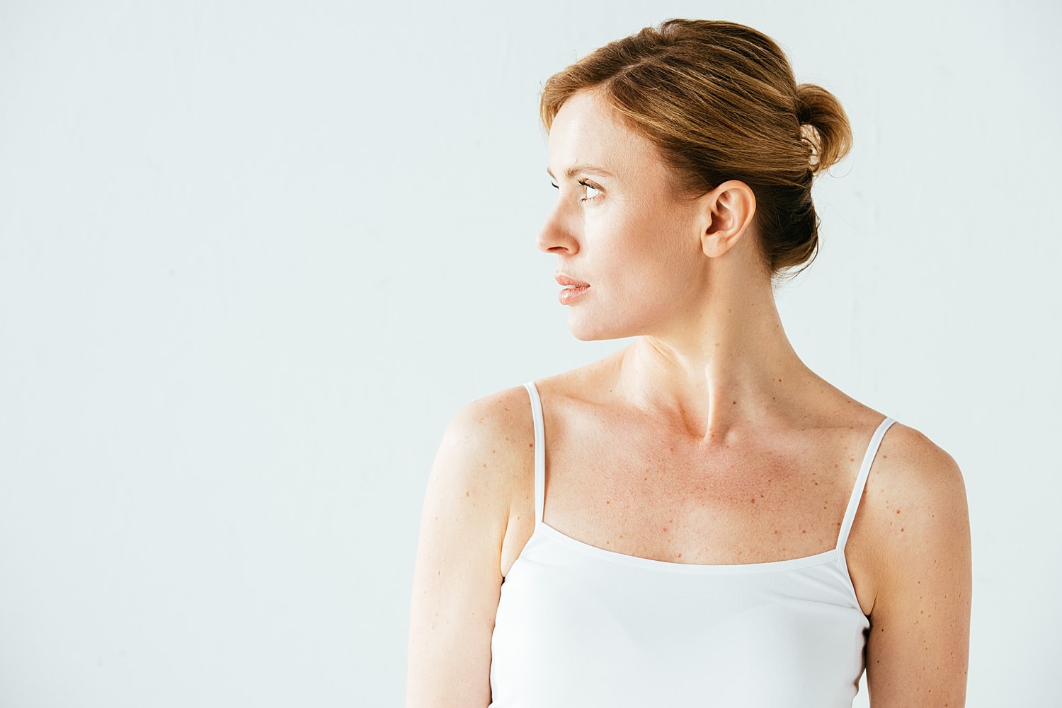 Profile of a woman against a light background.