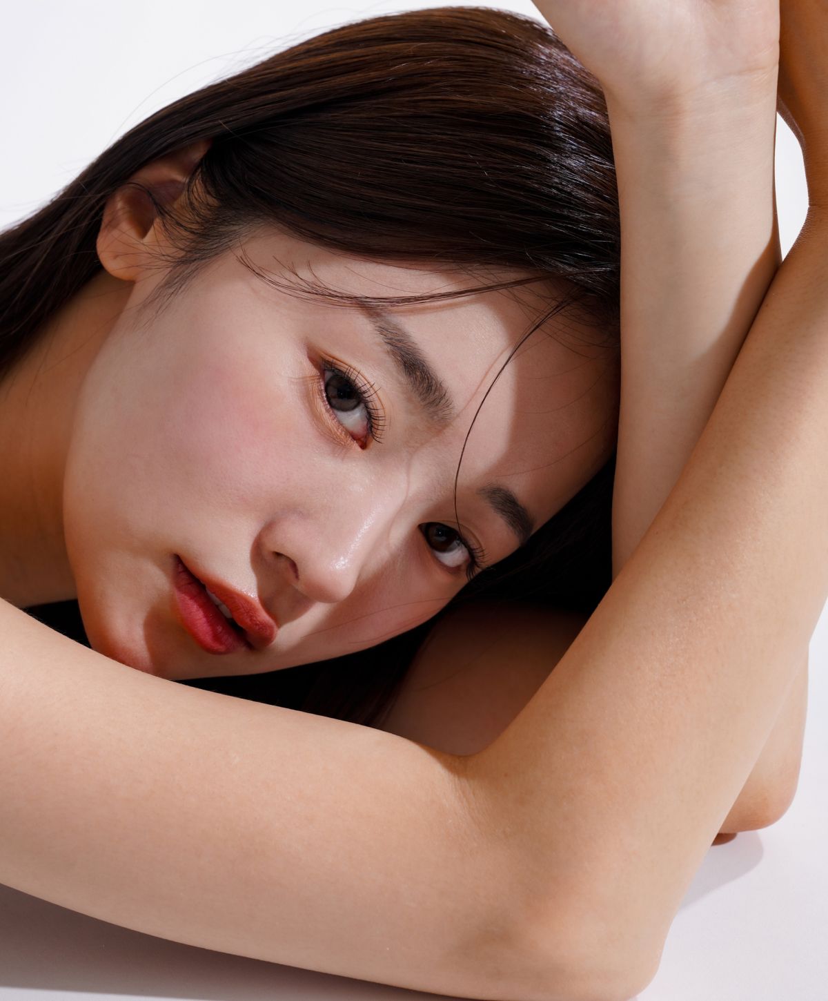 Close-up of a woman resting her head.