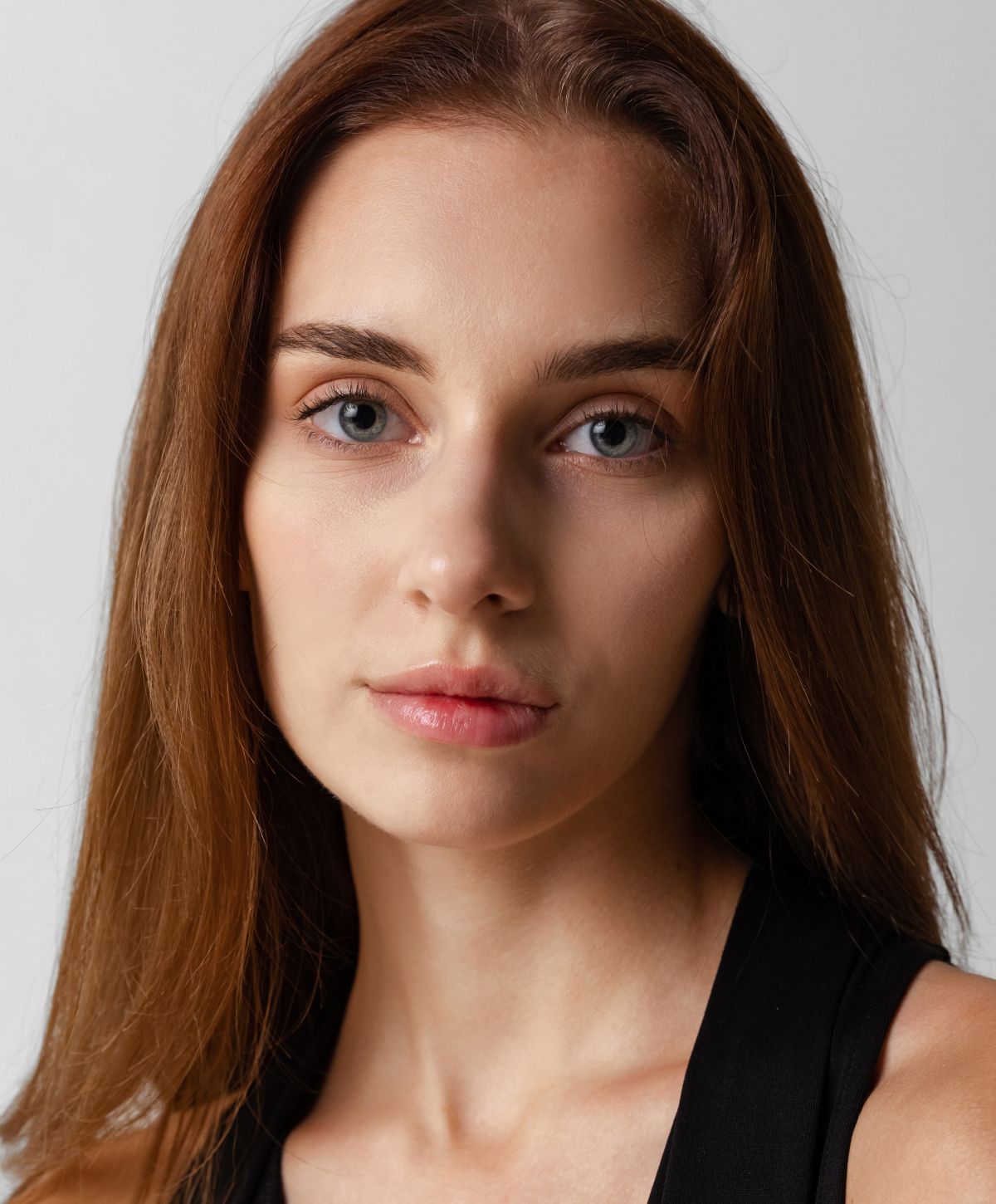 Portrait of a woman with long brown hair.