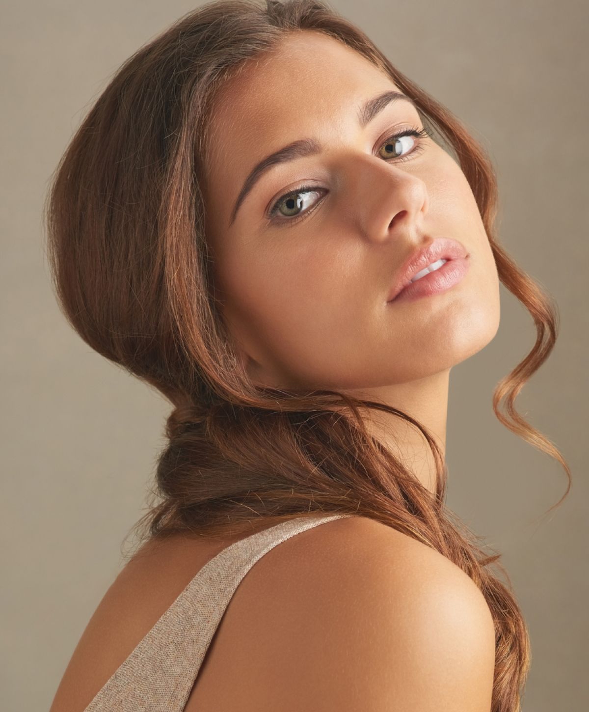 Close-up of a woman with long, wavy hair.