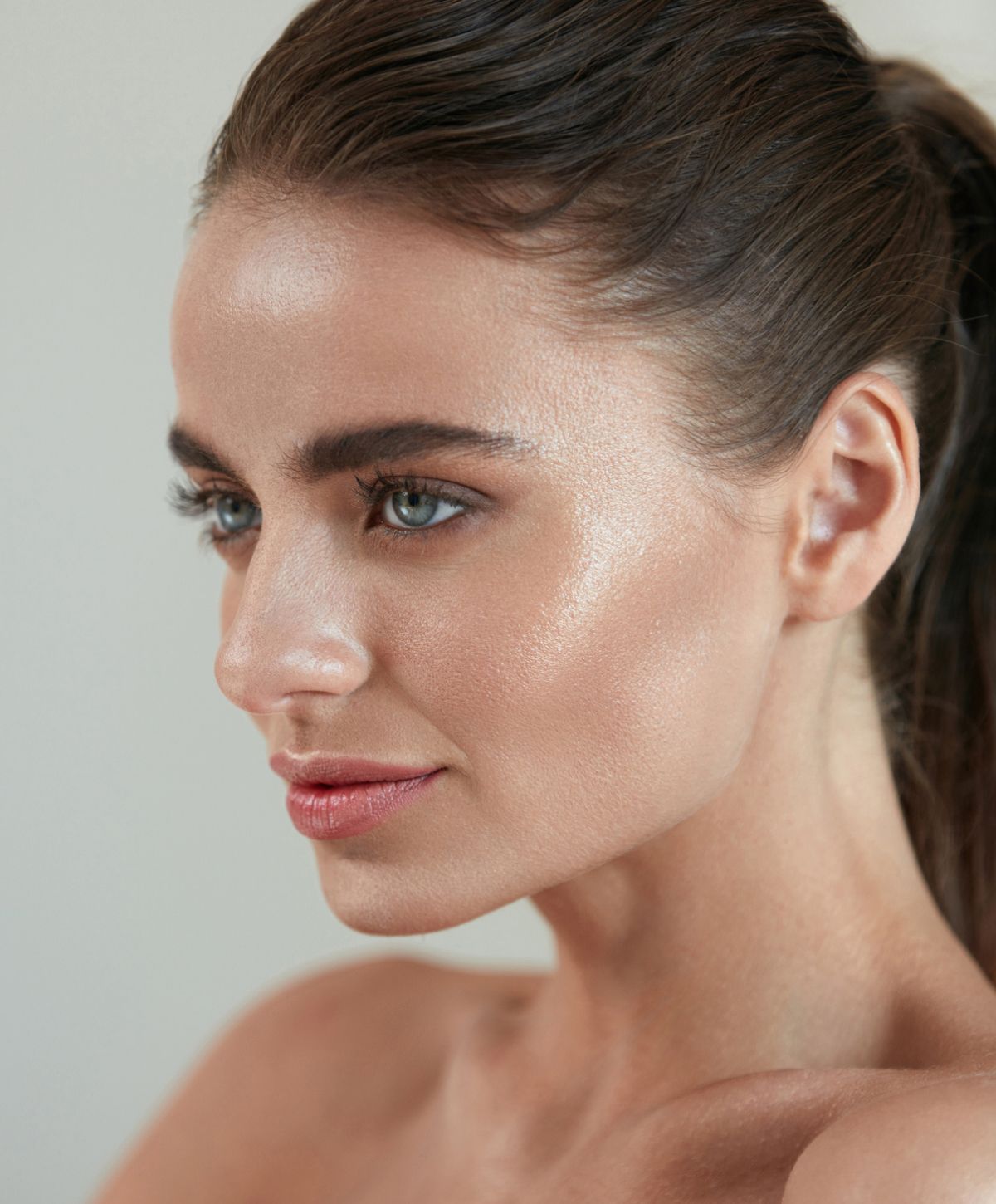 Profile of a woman with glowing skin.