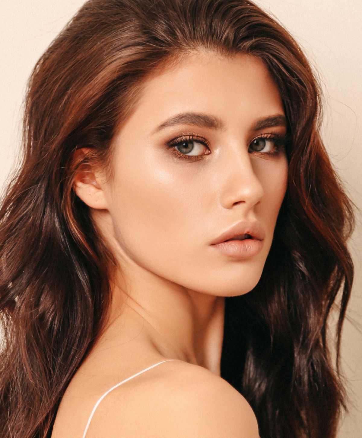 Portrait of a young woman with long hair.