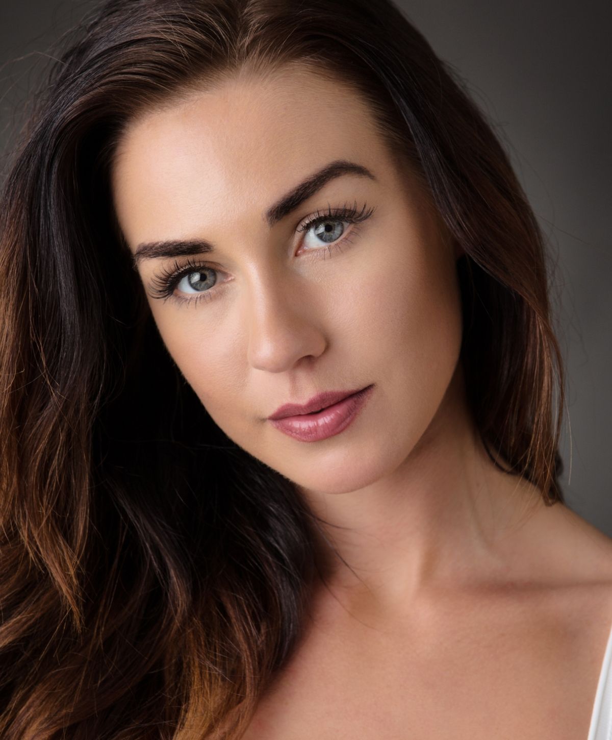 Close-up portrait of a woman with long hair.