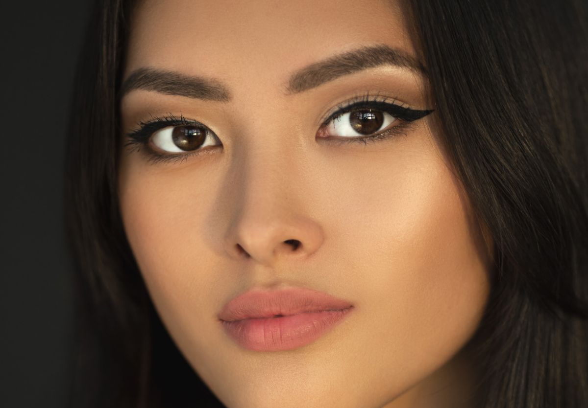 Close-up of a woman’s face with makeup.