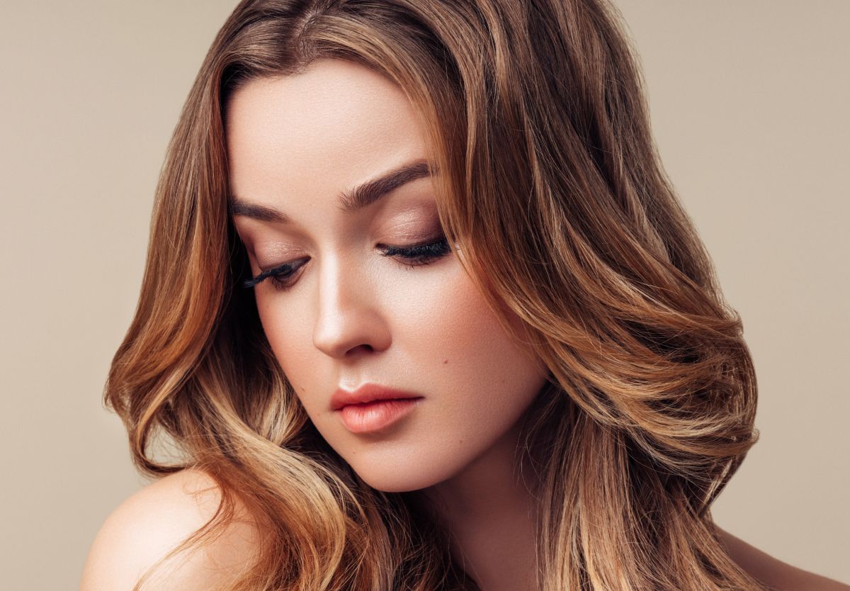 Woman with soft features and flowing hair.